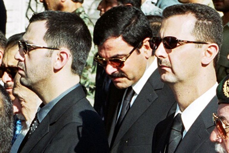 Syrian President Bashar al-Assad (R), his brother Maher (L) and brother-in-law Major General Assef Shawkat (C) stand during the funeral of late president Hafez al-Assad in Damascus in this June 13, 2000 file photo. Syria is considering a formal U.N. request to question six Syrian officials in Lebanon in connection with the killing of former Lebanese Prime Minister Rafik al-Hariri, a Syrian official said on November 7, 2005. In Beirut, a Lebanese political source said Shawkat, head of military intelligence, is among the six. REUTERS /Khaled al-Hariri/Files