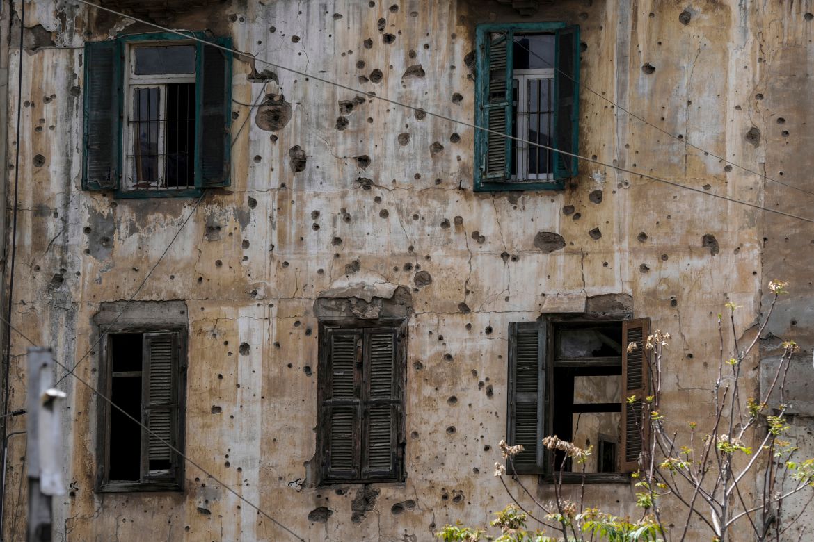 A building that is still riddled with bullets and shells from previous fighting during Lebanon's civil war on a former Beirut frontline, Lebanon, Wednesday, April 9, 2025. (AP Photo/Bilal Hussein)