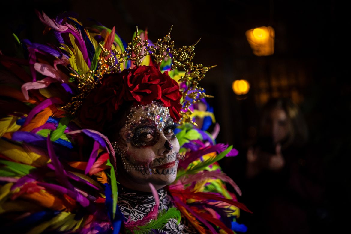 epaselect epa12498234 A person with Catrina makeup reacts during the traditional Dia de Muertos (Day of the Dead) festival, in Prague, Czech Republic, 01 November 2025. The celebration, organized by the Mexican community in the Czech Republic since at least 2002, features a colorful procession, face painting, live music, folklore, crafts, and food. EPA/MARTIN DIVISEK