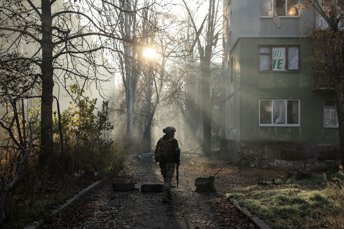 A Ukrainian serviceman walks near apartment buildings damaged by Russian military strike, amid Russia's attack on Ukraine, in the frontline town of Kostiantynivka in Donetsk region, Ukraine November 15, 2025. Oleg Petrasiuk/Press Service of the 24th King Danylo Separate Mechanized Brigade of the Ukrainian Armed Forces/Handout via REUTERS ATTENTION EDITORS - THIS IMAGE HAS BEEN SUPPLIED BY A THIRD PARTY.