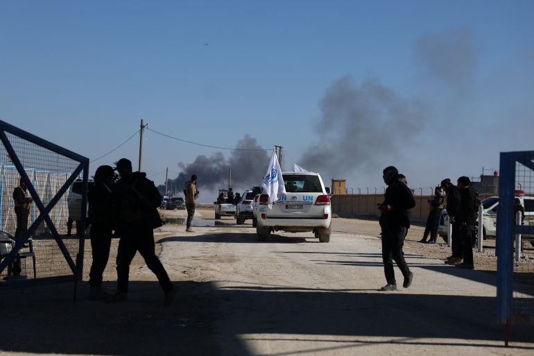 U.N vehicles drive inside the al-Hol camp in northeastern Syria's Hasakeh province, Syria, Wednesday, Jan. 21, 2026. (AP Photo/Ghaith Alsayed)