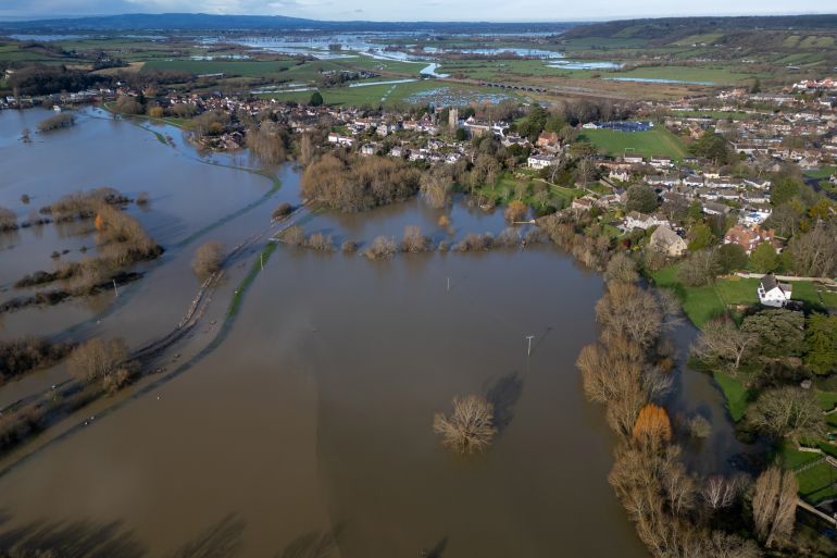 LANGPORT, UNITED KINGDOM - JANUARY 28: Flood water surrounds Langport on the Somerset Levels following heavy rain on January 28, 2026 in Somerset, England. Storm Chandra brought strong winds and heavy rain across much of the country which lashed large parts of the country, hitting travel and cutting power. While across the UK numerous flood warnings were still in place after weeks of heavy rainfall, the UK's Environment Agency has warned people to expect flooding to become more frequent because of climate change. (Photo by Anna Barclay/Getty Images)
